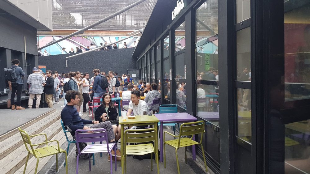 Event in the courtyard of 42 school in Paris, in front of the cantina.